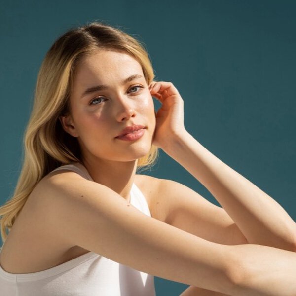 Woman with glowing complexion posing