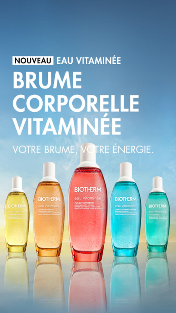 Brume corporelle vitaminee Eau Vitaminee de Biotherm : cinq flacons colores (jaune, orange, rouge, turquoise et vert) alignes sur un fond degrade bleu et jaune, avec le texte « Nouveau – Eau Vitaminee. Brume corporelle vitaminee. Votre brume, votre energie. »